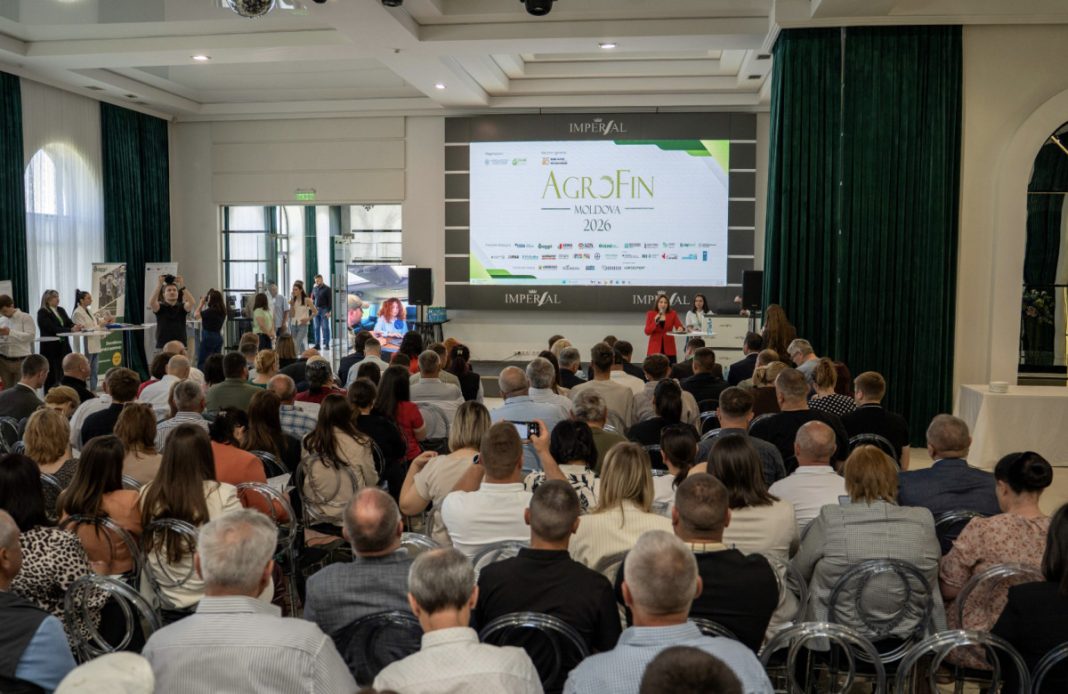 Conference hall with a large audience facing a stage and a screen that reads 'AGROFIN Moldova 2026'